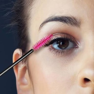 A cosmetic mascara wand with a bristled applicator