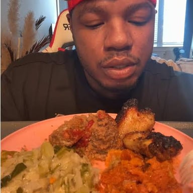 A person eating supper at home rather than dining out.
