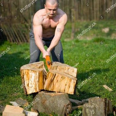 An axe being used to chop a piece of wood.