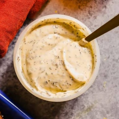 A bowl of creamy garlic aioli served as a dip.