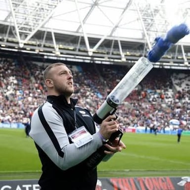 A T-shirt cannon launching shirts into a sports crowd.