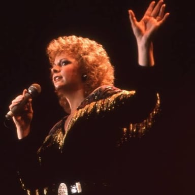 Reba McEntire performing onstage