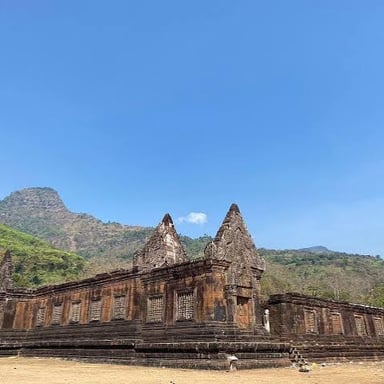 The ancient Vat Phou temple complex in southern Laos, set below a mountain.