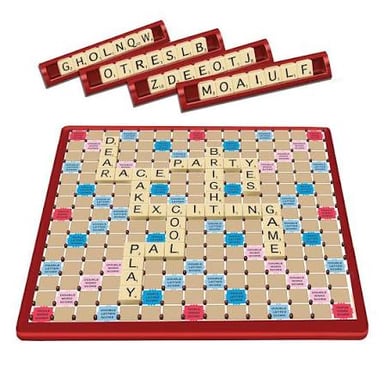 A Scrabble board surrounded by word-game tiles