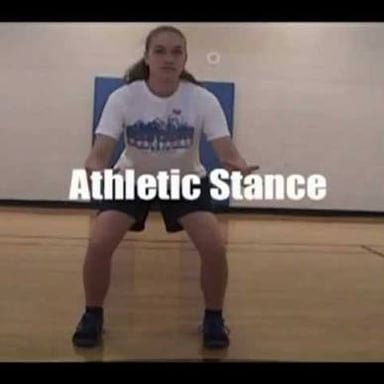 A person holding a deliberate standing stance.
