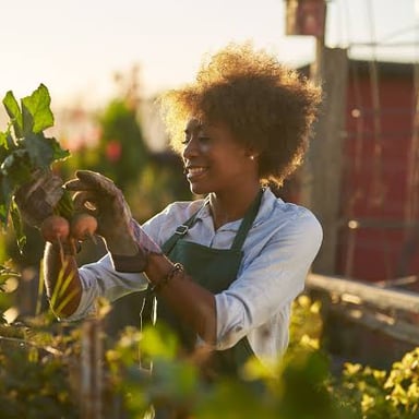 A person tending plants as a hobby in their free time.