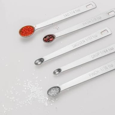 A teaspoon holding a small amount of an ingredient.