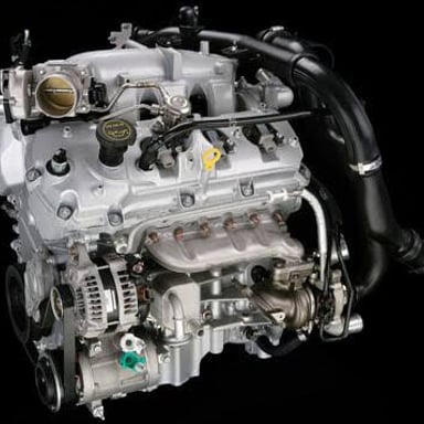 A Ford EcoBoost engine installed beneath a vehicle's hood.