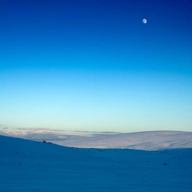 A clear blue sky over a landscape