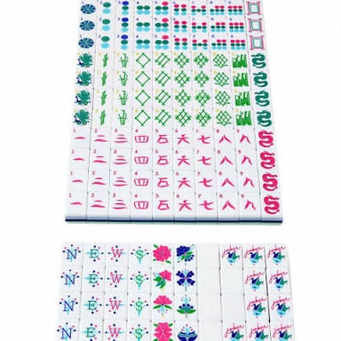 A set of mahjong tiles, including numbered suit tiles and honor tiles.