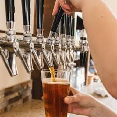 A tap handle identifying an India pale ale at a brewery.
