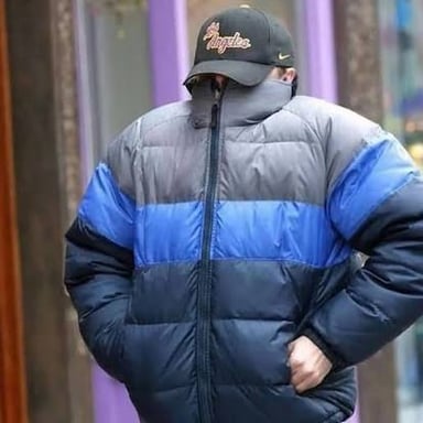 A celebrity attempting to hide from photographers