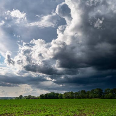A dark, gloomy scene under storm clouds