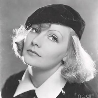 A female actor depicted wearing a beret.