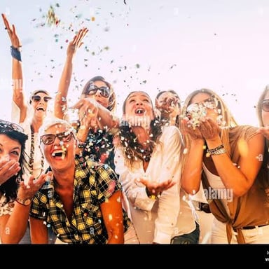 A group of friends laughing together at a party.
