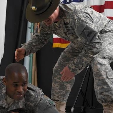 A sergeant instructing recruits during military training