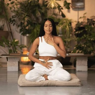A person holding a yoga pose in a studio