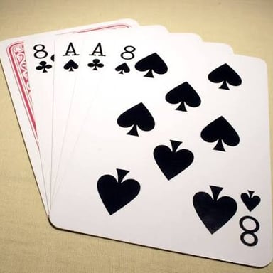 An ace playing card beside other cards in a blackjack hand.