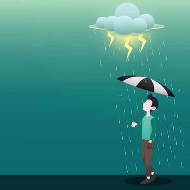 A person using an umbrella during rainfall