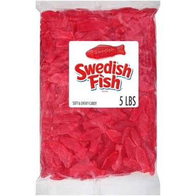 Red fish-shaped Swedish Fish gummy candies.