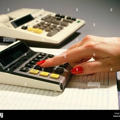 A person totaling numbers with a calculator and written notes.