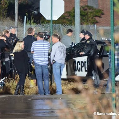 A film crew preparing to repeat a scene for another take.