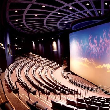 A giant IMAX movie screen inside a theater
