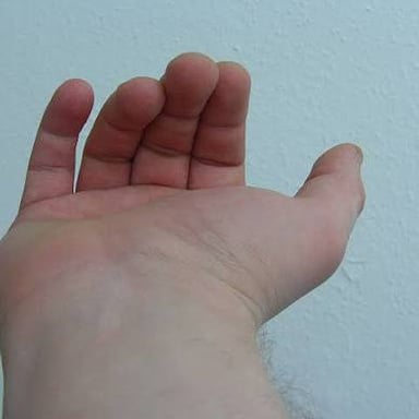 A person responding to someone’s beckoning hand