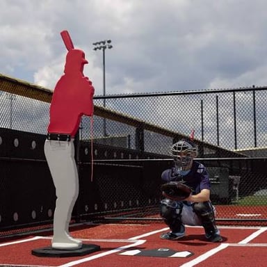 A baseball batter swinging at a pitch at home plate.