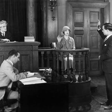 A witness giving firsthand testimony in a courtroom.