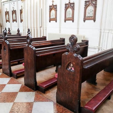 Rows of benches arranged for churchgoers.