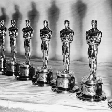 An awards ceremony featuring a trophy for a best-category winner.