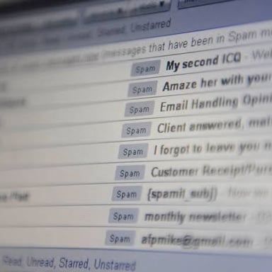 An email inbox with a list of messages on a computer screen.
