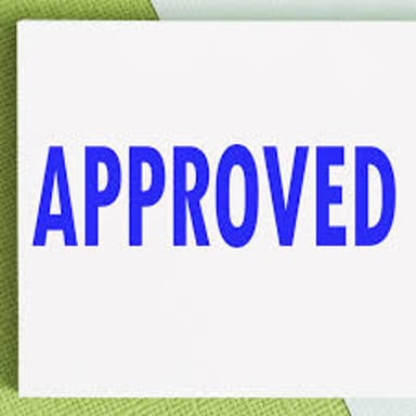An approval mark showing OK