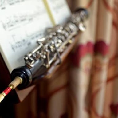 An oboe, a long woodwind instrument with keys and a flared bell.