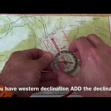 A person using a map to determine their surroundings