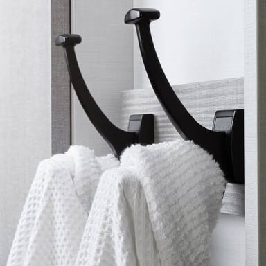 A winter coat hanging from a hook.