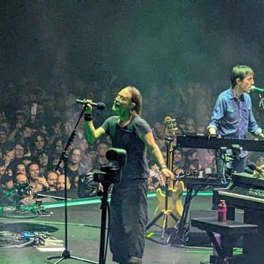 The rock band Radiohead performing onstage.