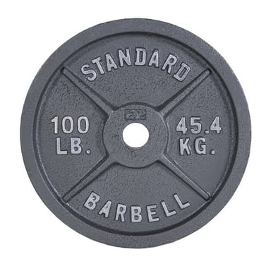 A loaded barbell with weight plates in a gym