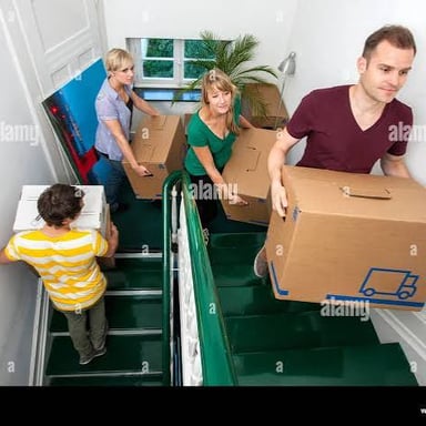People carrying boxes out of an apartment.