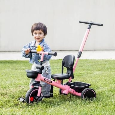 A young child riding a tricycle, illustrating the rhyme in the clue.