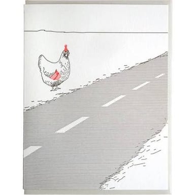 A chicken crossing a road.