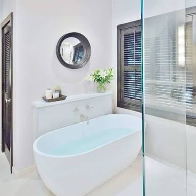 A bathtub in a bathroom.