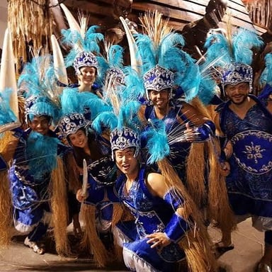 Samba dancers and percussionists performing in a Rio Carnival parade.