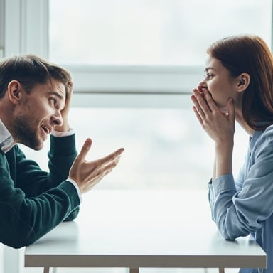 Two people conversing as one person realizes the point being explained.