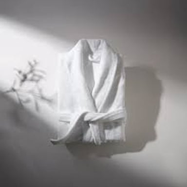 A plush bathrobe hanging in a bathroom