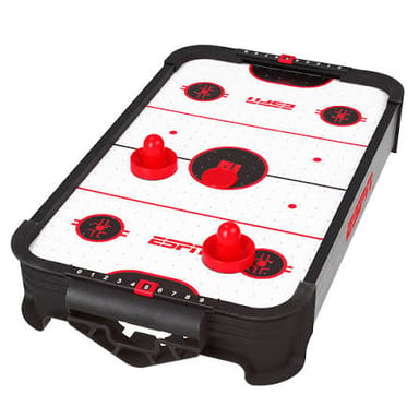 An air hockey table with a plastic puck and mallets.