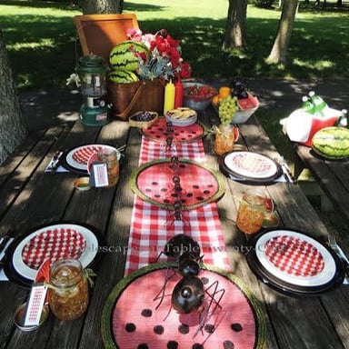 An ant crawling near food at an outdoor picnic.