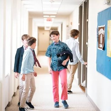 Middle school students in a school hallway
