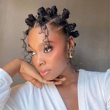 Hair arranged in small twisted coils against the scalp.
